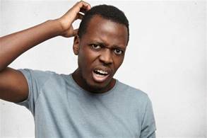 Headshot of clueless perplexed young african american man in grey t-shirt looking with confused ...